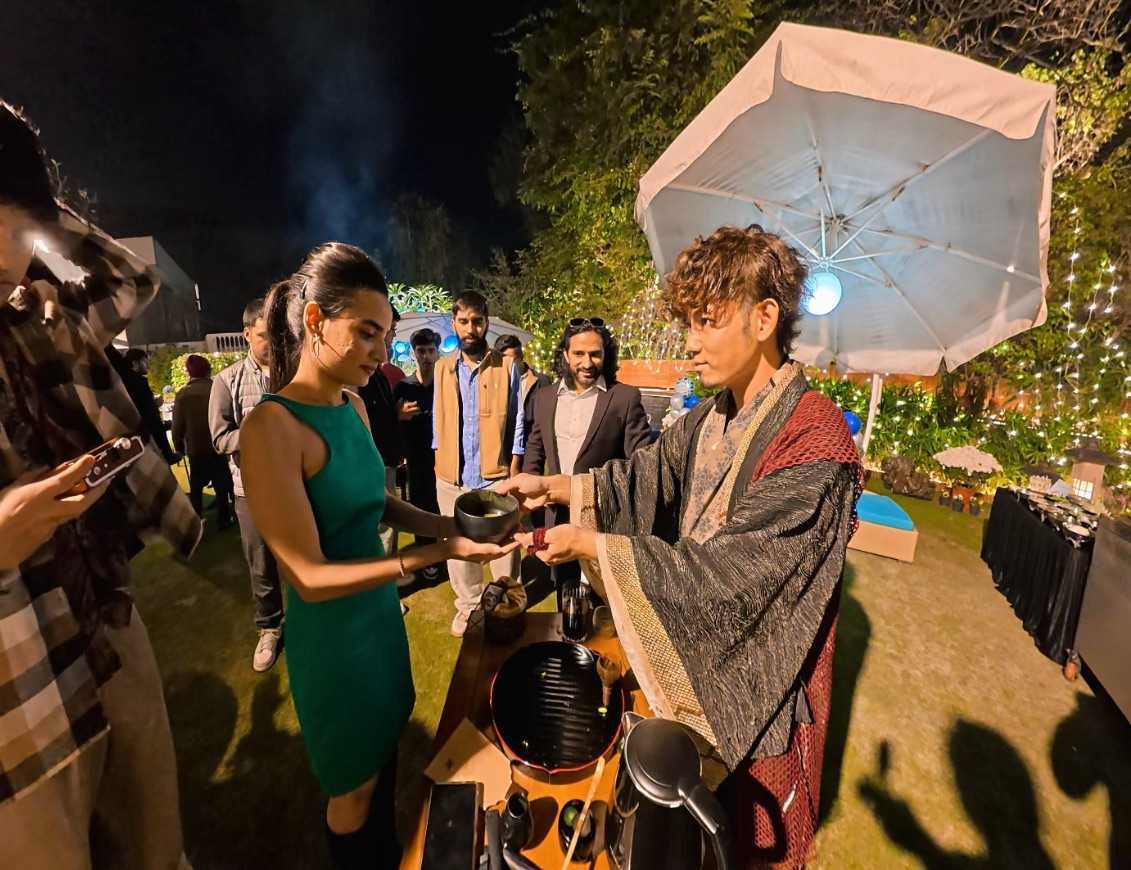 Masaki serving matcha at an outdoor event